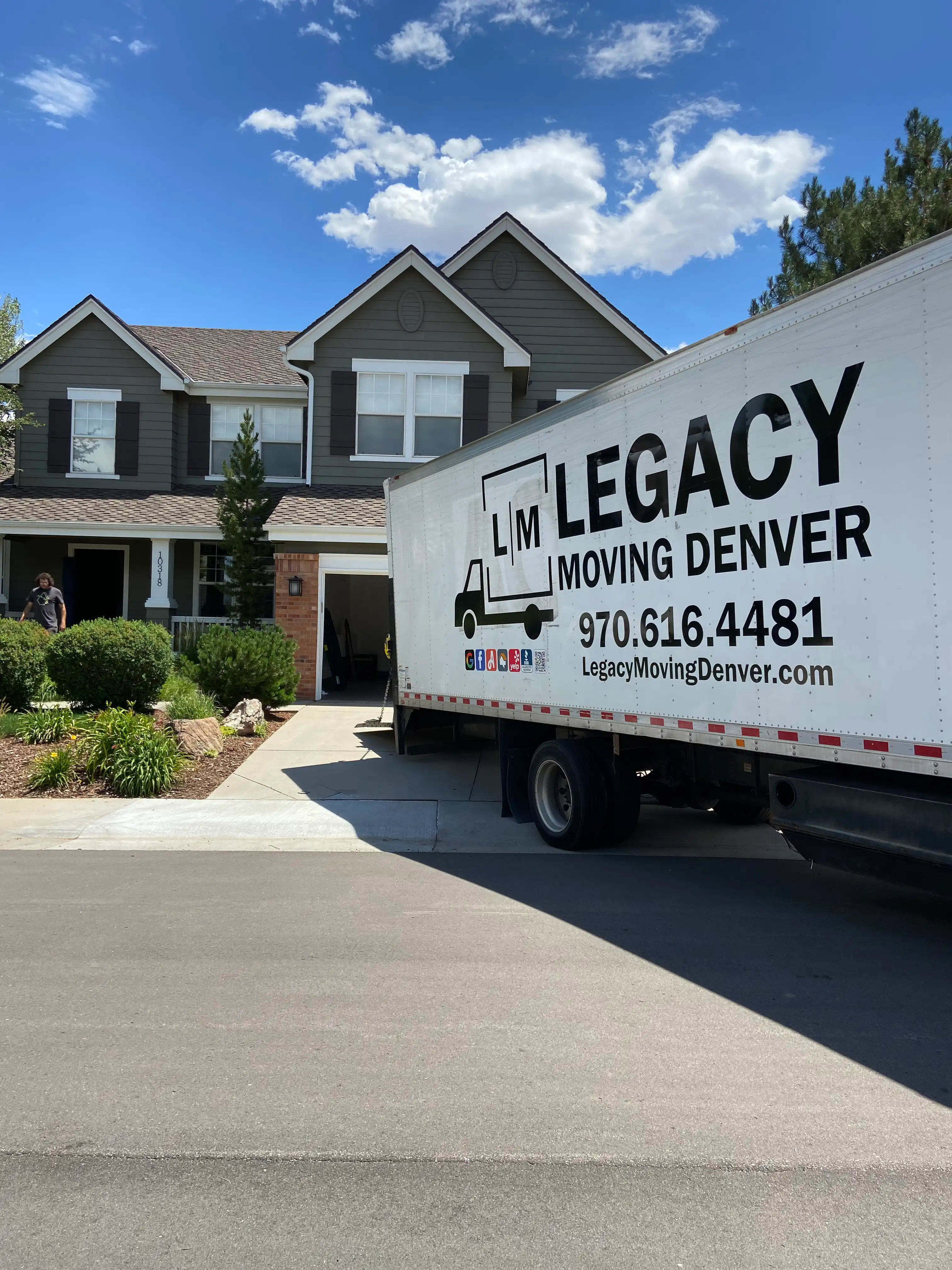 Legacy Moving Denver truck parked at a Denver home